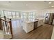 Open-concept kitchen with a large center island, stainless steel appliances, and lots of natural light at 91 Brooklynn Trl # 187, Angier, NC 27501