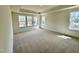 Large main bedroom with a tray ceiling and three windows, providing plenty of natural light at 91 Brooklynn Trl # 187, Angier, NC 27501
