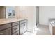 Bright bathroom features double vanity, stone countertops, and separate shower and tub at 9512 Wood River Dr, Zebulon, NC 27597