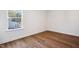 This bright bedroom offers wood-look flooring and base trim at 9512 Wood River Dr, Zebulon, NC 27597