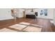 Open-concept living space featuring a kitchen with a central island and luxury vinyl flooring throughout the room at 9512 Wood River Dr, Zebulon, NC 27597