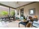 Inviting covered back patio area with dining set, seating, and decorative lighting at 989 Ambergate Sta, Apex, NC 27502