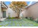 Serene backyard featuring lush greenery, stone pavers, and a decorative tree at 989 Ambergate Sta, Apex, NC 27502