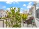 Upstairs balcony with plants and seating offers an inviting outdoor space at 989 Ambergate Sta, Apex, NC 27502