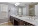 Bright bathroom featuring double sinks, silver fixtures, and a shower and tub combination at 989 Ambergate Sta, Apex, NC 27502