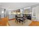 Charming dining area featuring a round table, upholstered chairs, and open access to the kitchen at 989 Ambergate Sta, Apex, NC 27502