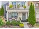 Cozy front porch with seating and a wreath on the door, leading to the home's entrance at 989 Ambergate Sta, Apex, NC 27502