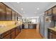 Well-equipped kitchen with stainless steel appliances and dark wood cabinetry at 989 Ambergate Sta, Apex, NC 27502