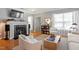 Cozy living room with a fireplace, bookshelf, and hardwood floors offering a welcoming atmosphere at 989 Ambergate Sta, Apex, NC 27502