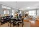 Bright living room featuring a fireplace, bookshelf, hardwood floors, and comfortable seating at 989 Ambergate Sta, Apex, NC 27502