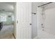 Bathroom with tub and shower combination, tile walls and floor at 1003 Buckhorn Rd, Garner, NC 27529