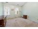 Bedroom with neutral carpet, trim, and window that provides natural light at 1003 Buckhorn Rd, Garner, NC 27529