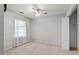 Bedroom featuring light carpet, single window, and closet at 1003 Buckhorn Rd, Garner, NC 27529