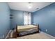 Brightly colored bedroom with a bed and single window for natural light at 1003 Buckhorn Rd, Garner, NC 27529