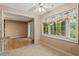 Bright breakfast nook with views and a ceiling fan with a doorway to the deck at 1003 Buckhorn Rd, Garner, NC 27529