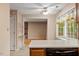Sunlit breakfast nook with a ceiling fan, window view, and access to living area at 1003 Buckhorn Rd, Garner, NC 27529