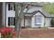 Traditional two-story home featuring white siding, black shutters, and a cozy bay window overlooking the landscaped front yard at 1003 Buckhorn Rd, Garner, NC 27529