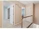 Upstairs hallway with Memory Treasure wall hanging and doors leading to rooms at 1003 Buckhorn Rd, Garner, NC 27529