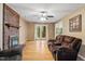 Spacious living room features a brick fireplace, hardwood floors, and access to back yard at 1003 Buckhorn Rd, Garner, NC 27529