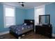 Bedroom with a bed, dresser, wood floors and lots of natural light at 10095 N Walnut St St, Middlesex, NC 27557
