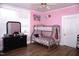 Playful bedroom featuring a bunk bed, new floors, dresser, and colorful decor at 10095 N Walnut St St, Middlesex, NC 27557
