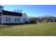 Traditional home boasting a well-maintained lawn, mature landscaping, and convenient parking in a desirable location at 10095 N Walnut St St, Middlesex, NC 27557