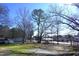 Residential street view showcasing mature trees, well-maintained lawns, and neighborhood charm for a peaceful setting at 10095 N Walnut St St, Middlesex, NC 27557