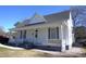 Traditional home exterior with a welcoming front porch, featuring classic architecture and a cozy feel at 10095 N Walnut St St, Middlesex, NC 27557