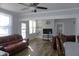 Bright living room showcasing new floors, complemented by natural light and modern ceiling fan at 10095 N Walnut St St, Middlesex, NC 27557