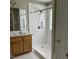 Bathroom featuring a walk-in shower with safety bars and single sink vanity at 103 Kiowa Cv, Louisburg, NC 27549