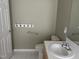 Bathroom featuring a vanity, toilet and accessibility handles at 103 Kiowa Cv, Louisburg, NC 27549