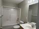 Bathroom featuring a shower-tub combination and single sink vanity at 103 Kiowa Cv, Louisburg, NC 27549