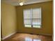 Bedroom with a window, ceiling fan, and hardwood floors at 103 Kiowa Cv, Louisburg, NC 27549