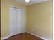 Bedroom with a ceiling fan and double closet doors at 103 Kiowa Cv, Louisburg, NC 27549