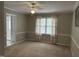 Bedroom with carpet, a ceiling fan, and natural light at 103 Kiowa Cv, Louisburg, NC 27549