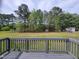 View from the backyard deck, featuring a large backyard and storage shed at 1033 Silas Moore Rd, Benson, NC 27504