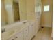 Well-appointed bathroom with double sink vanity and separate shower and toilet area at 1033 Silas Moore Rd, Benson, NC 27504