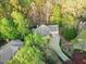 Beautiful house with driveway surrounded by lush trees at 10370 Spaight, Chapel Hill, NC 27517