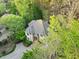 Aerial view of beautiful house surrounded by lush trees at 10370 Spaight, Chapel Hill, NC 27517
