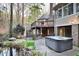 Relaxing backyard with a two-story deck, hot tub and pond at 10370 Spaight, Chapel Hill, NC 27517