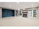 Finished basement features a fireplace, built-in shelves, and ample natural light from the windows at 10370 Spaight, Chapel Hill, NC 27517