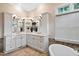 Elegant bathroom with double sink vanity, large mirror, and natural light at 10370 Spaight, Chapel Hill, NC 27517