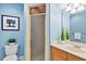 Bathroom with blue walls, a toilet, vanity, and shower with glass doors at 10370 Spaight, Chapel Hill, NC 27517