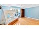 Bedroom has hardwood floors, blue walls, a window, a bookcase, and a canopy bed at 10370 Spaight, Chapel Hill, NC 27517