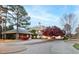 A grand clubhouse perfect for gatherings and events, with lush landscaping and a welcoming entrance at 10370 Spaight, Chapel Hill, NC 27517
