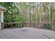 Spacious outdoor deck surrounded by lush greenery, perfect for relaxation at 10370 Spaight, Chapel Hill, NC 27517