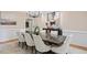 Spacious dining room showcasing a contemporary chandelier and hardwood flooring at 10370 Spaight, Chapel Hill, NC 27517