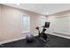 Bright exercise room featuring rubber flooring, natural light, and space for fitness equipment at 10370 Spaight, Chapel Hill, NC 27517