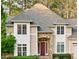 Close-up of a beautiful home's stone-accented entryway and well-maintained landscaping at 10370 Spaight, Chapel Hill, NC 27517