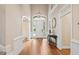 Grand foyer with hardwood floors, detailed trim, and a elegant hanging light fixture at 10370 Spaight, Chapel Hill, NC 27517
